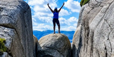 Kenyan Adventurer Polyn Monda Conquers Norway’s Famous Kjeragbolten Boulder Trek