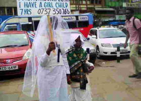 Woman Carries Placard in Streets of Nairobi in Search of Husband 