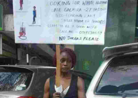 Kenyan Woman Carries Placard on the Streets Looking for a Mzungu Husband