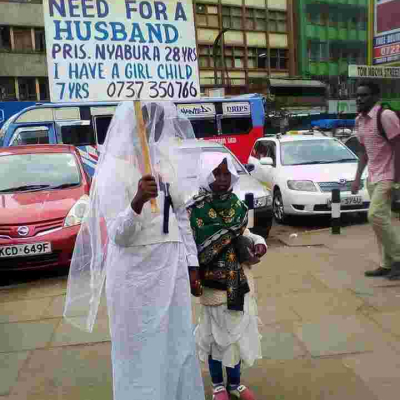 Woman Carries Placard in Streets of Nairobi in Search of Husband 