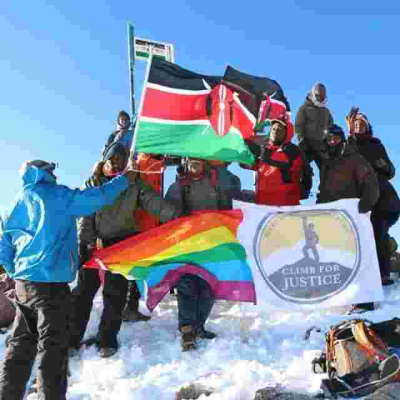 Members of Kenyan Gay Community Hoist Rainbow Flag at the Peak of Mt Kenya