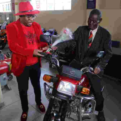 76-Year-Old Man Who Cycled 223Km to Attend Moi's Burial Receives Motorbike, Posho Mill from Sonko