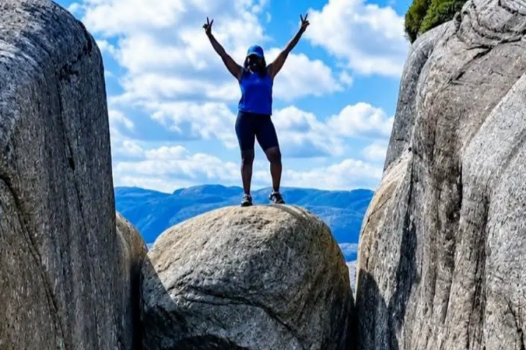 Kenyan Adventurer Polyn Monda Conquers Norway’s Famous Kjeragbolten Boulder Trek